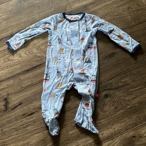 Magnetic Me footie pajamas with skiing dinosaur design